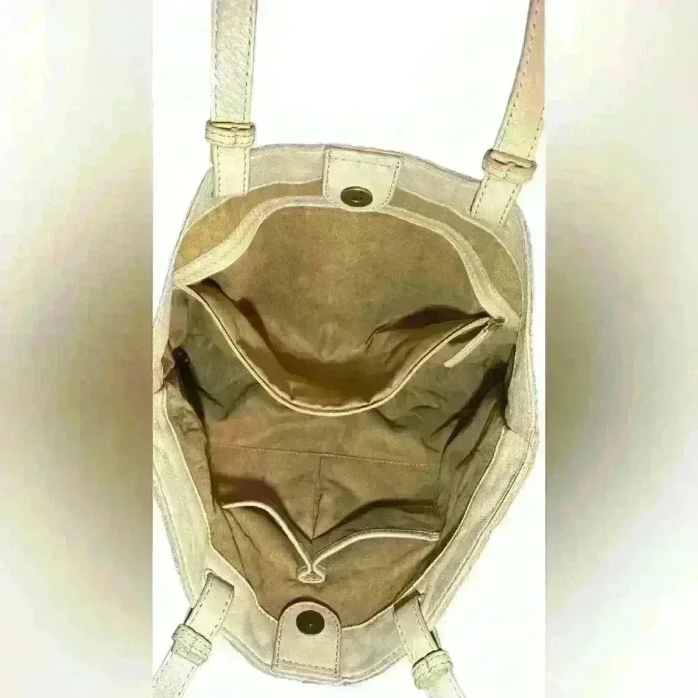 An American Leather Co. nude/cream colored leather woven tote bag.